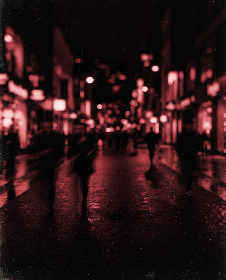 Neon and shopfronts along 5th Avenue after midnight